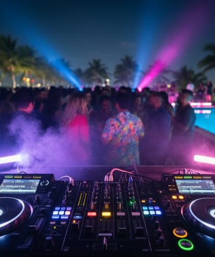 Neon-lit DJ booth with flashing lights, a crowd in light haze, and a rooftop pool reflection at a Miami after party during Ultra weekend.