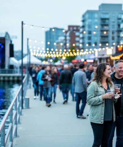 Crowds gather near an outdoor stage and harborfront lights during a multi-genre music festival in Canada’s east, highlighting the city-integrated festival atmosphere.